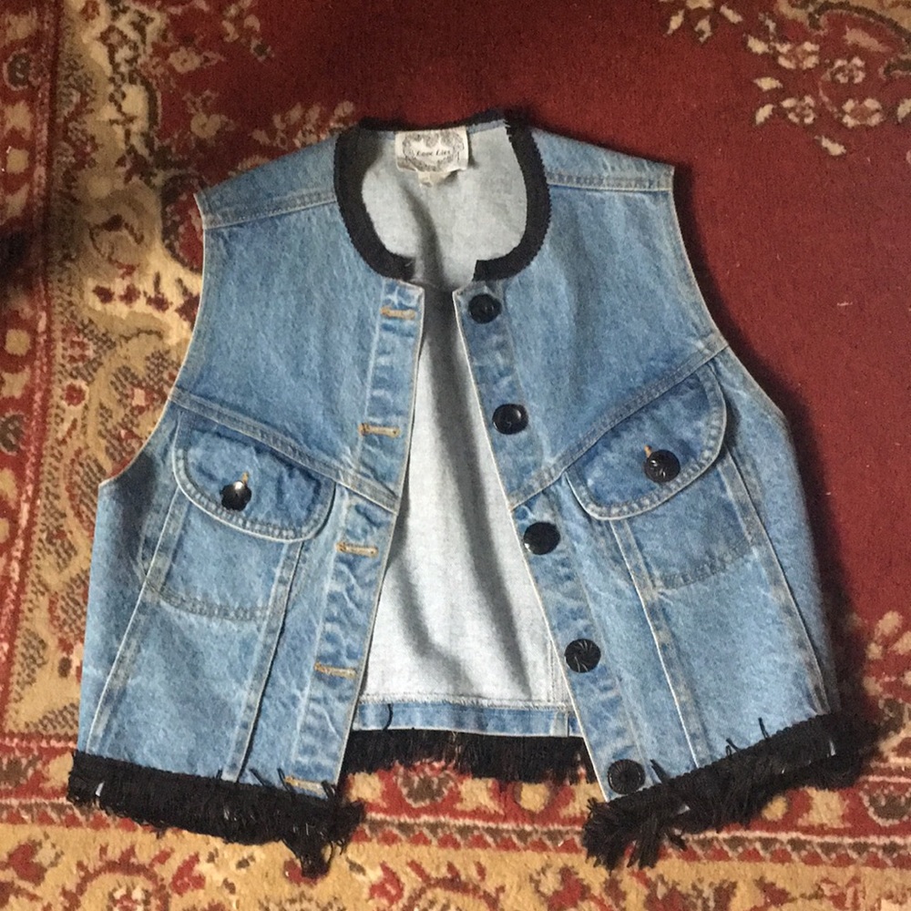 Denim vest with black fringe details